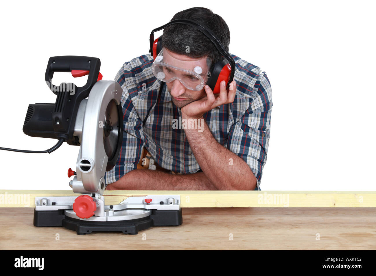 Carpenter using miter saw Stock Photo Alamy