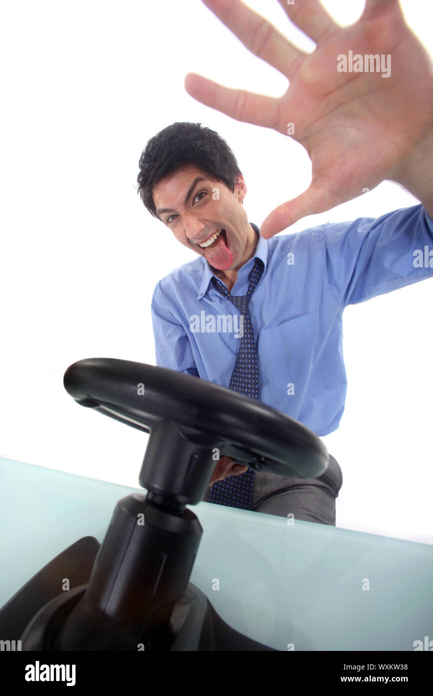 Businessman with steering wheel Stock Photo