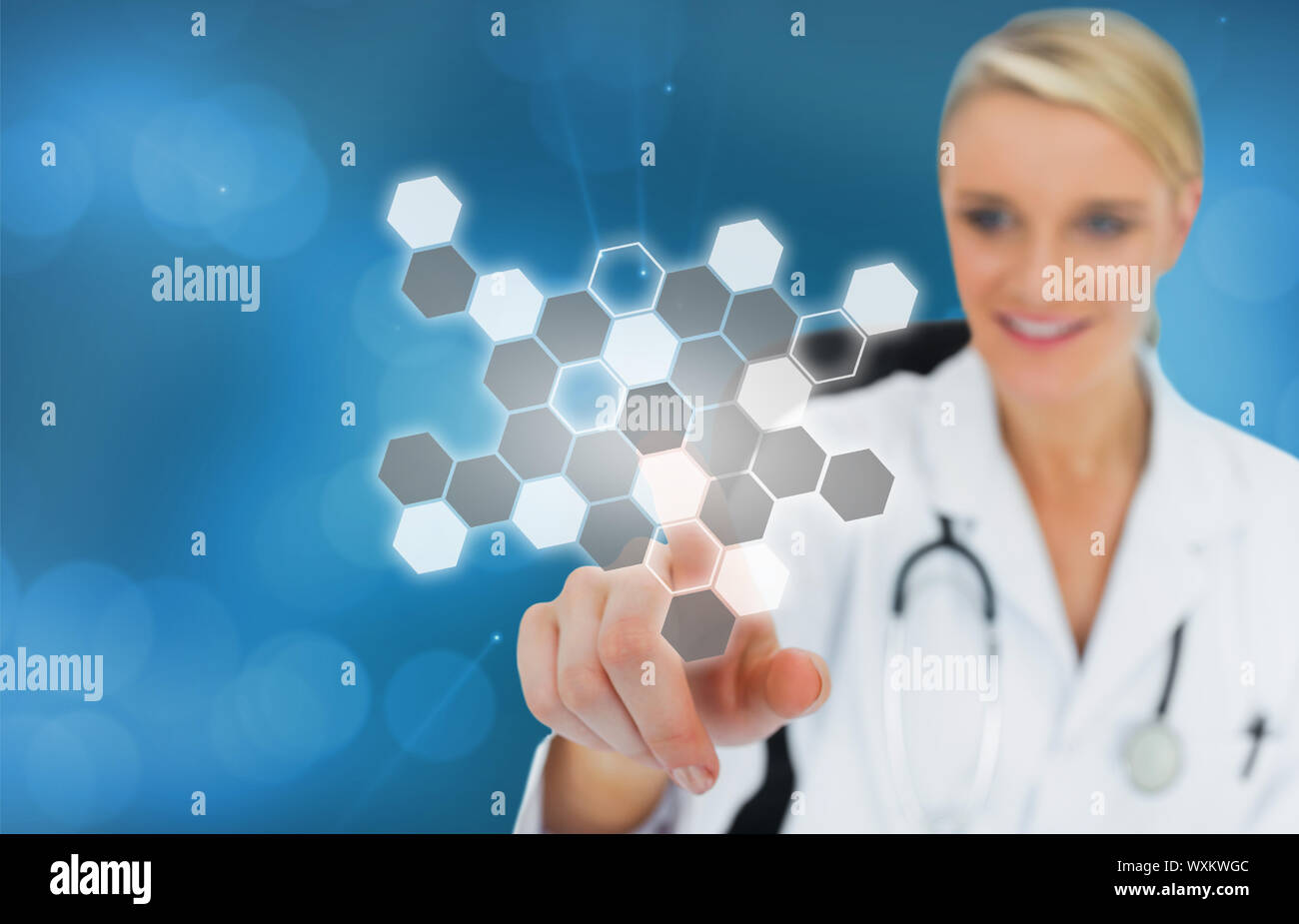 Blonde doctor pressing touchscreen displaying chemical formula on blue ...