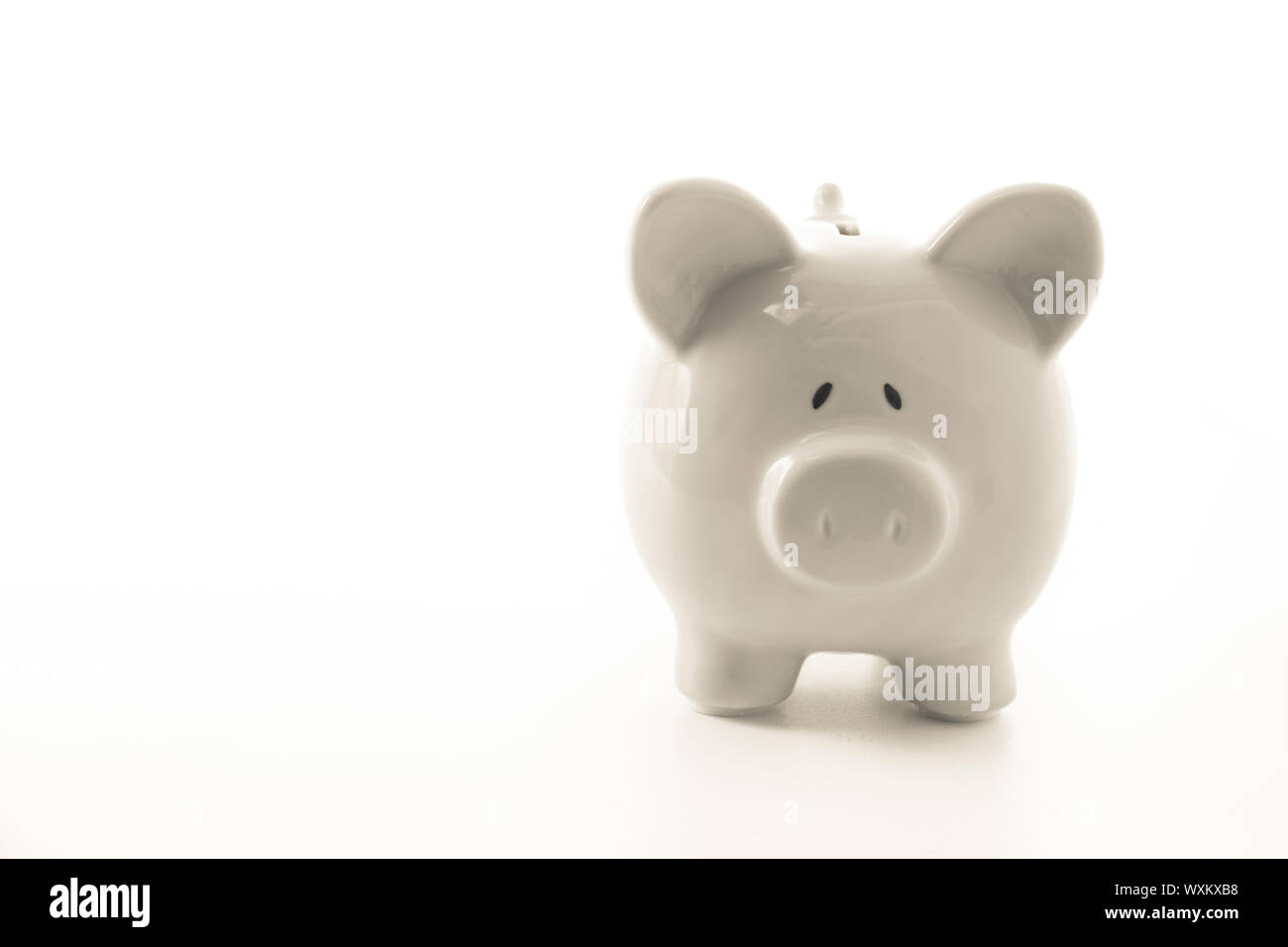White piggy bank with copy space on white background Stock Photo - Alamy
