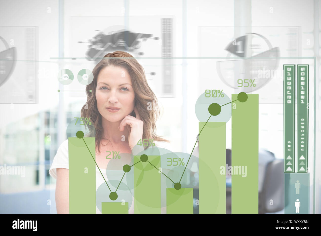 Blonde businesswoman using green chart interface with statistics Stock Photo