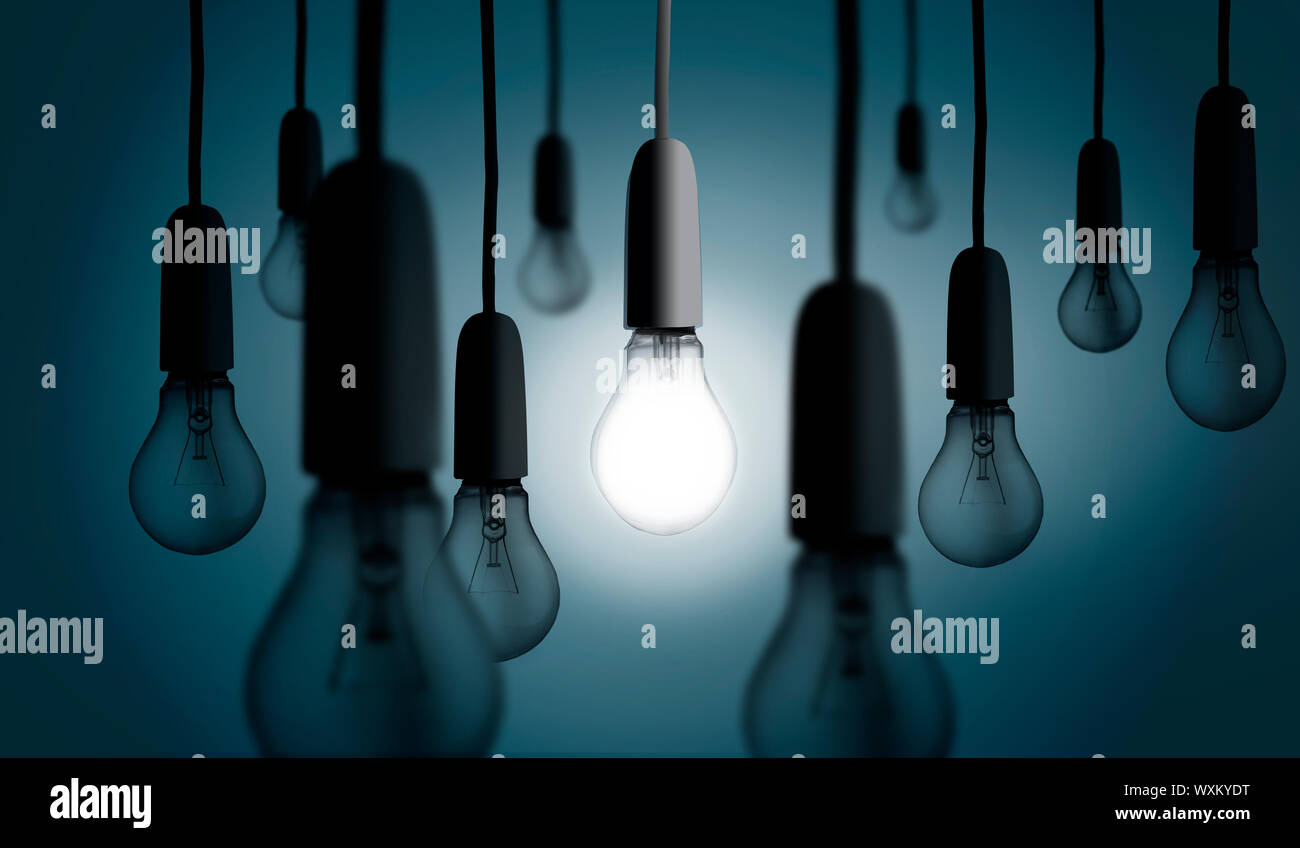 One light bulb lit up amongst others turned off Stock Photo Alamy