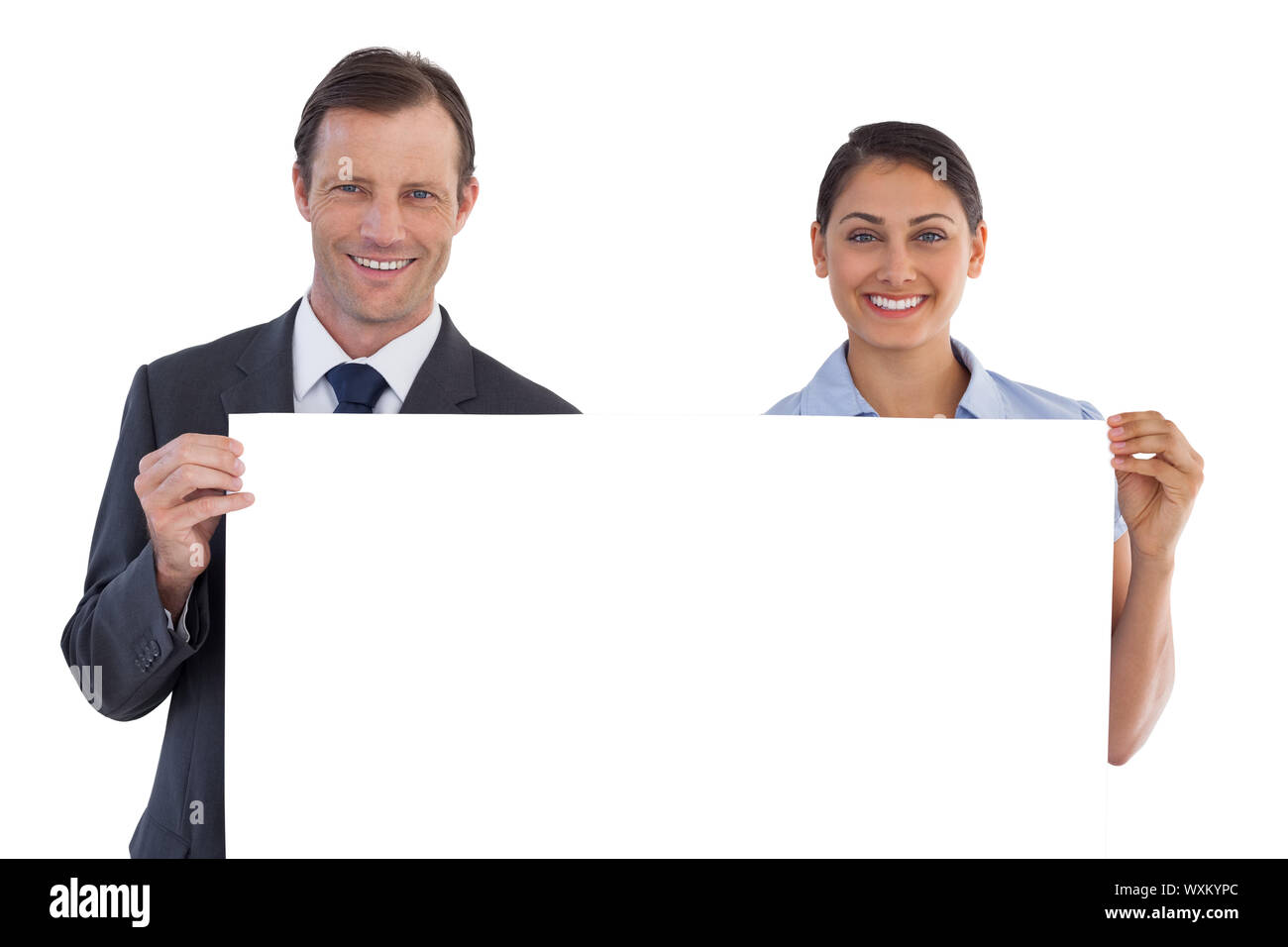 Smiling co workers holding a blank copy space on white background Stock Photo