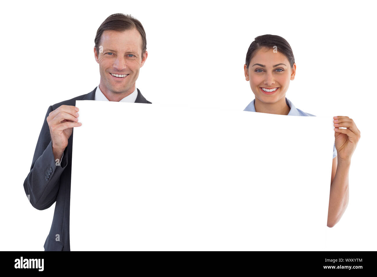 Co workers holding a blank copy space on white background Stock Photo