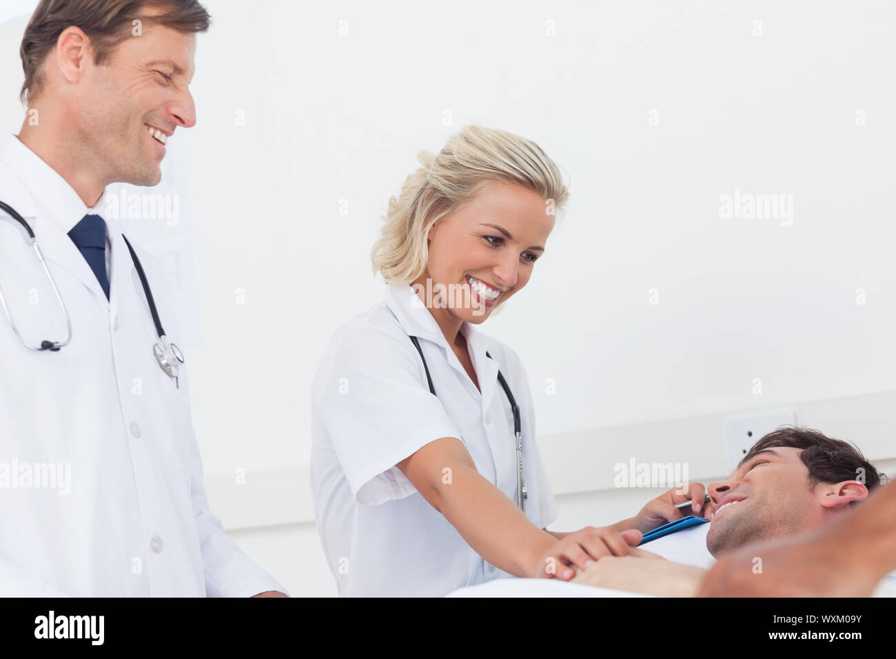 Medical team standing chatting hi-res stock photography and images - Alamy