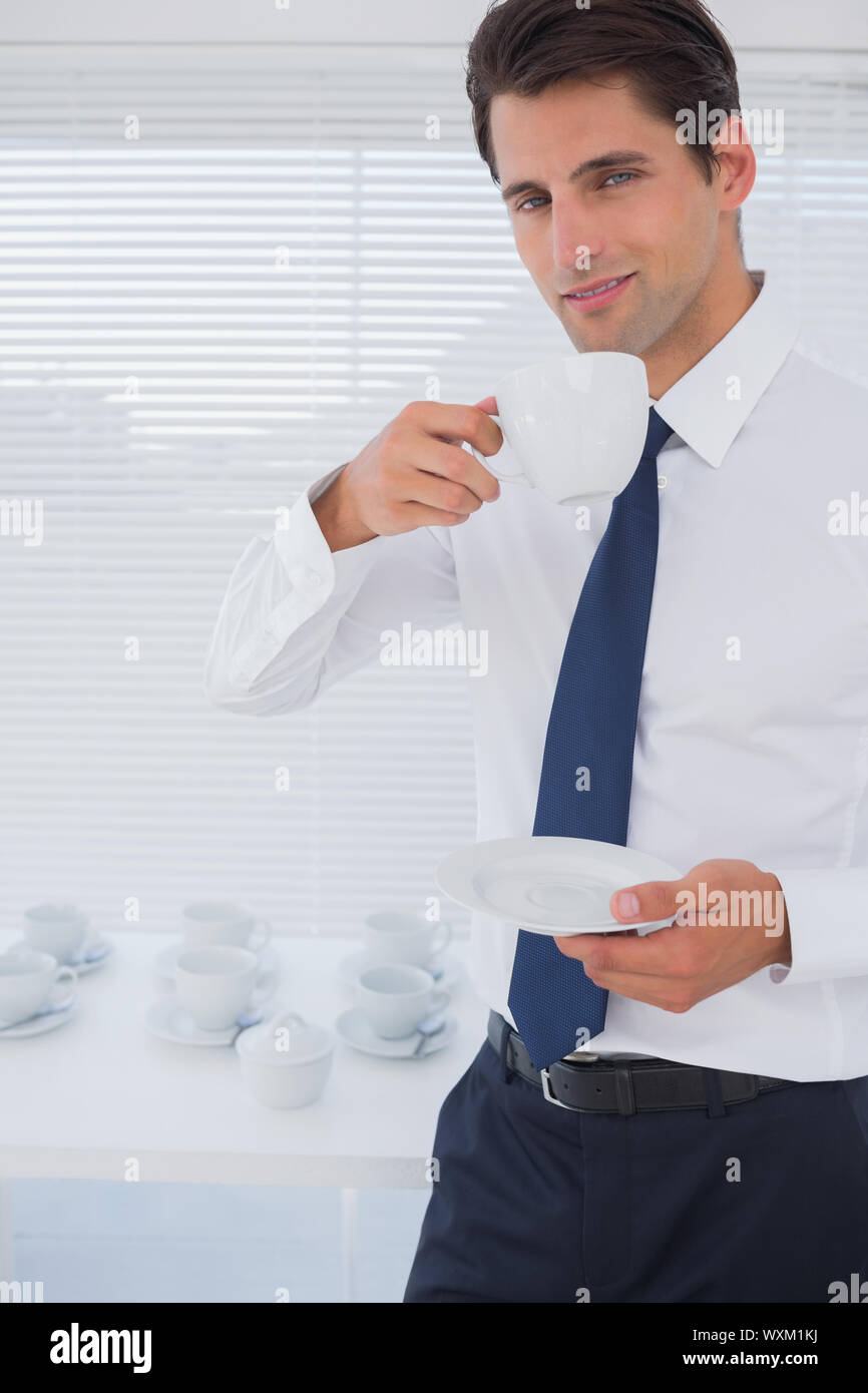 Handsome businessman having a coffee during the break Stock Photo