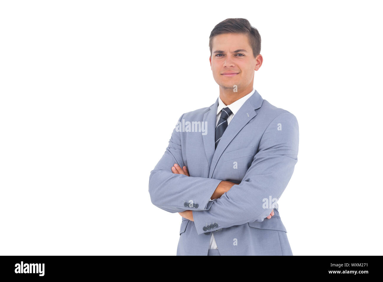 Smart businessman with arms crossed on a white background Stock Photo ...