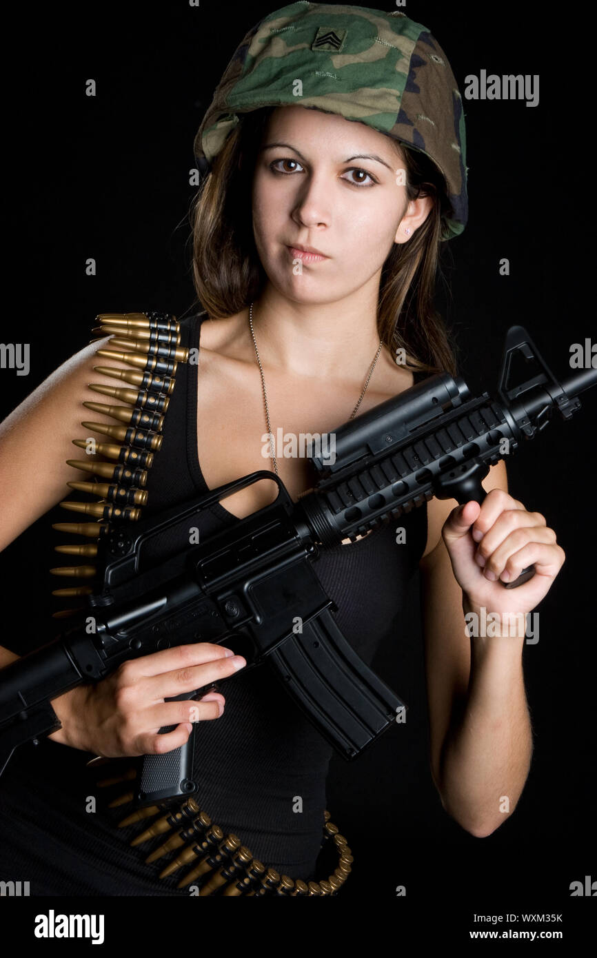 Army girl holding machine gun Stock Photo