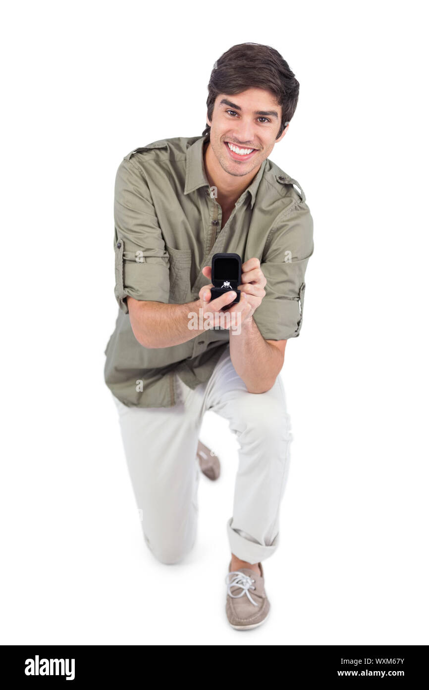 Young man making a marriage proposal with engagement ring Stock Photo