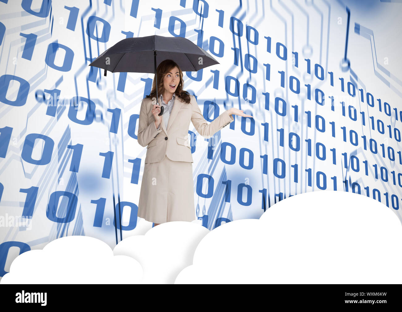 Businesswoman in front of printed circuit with binary code Stock Photo