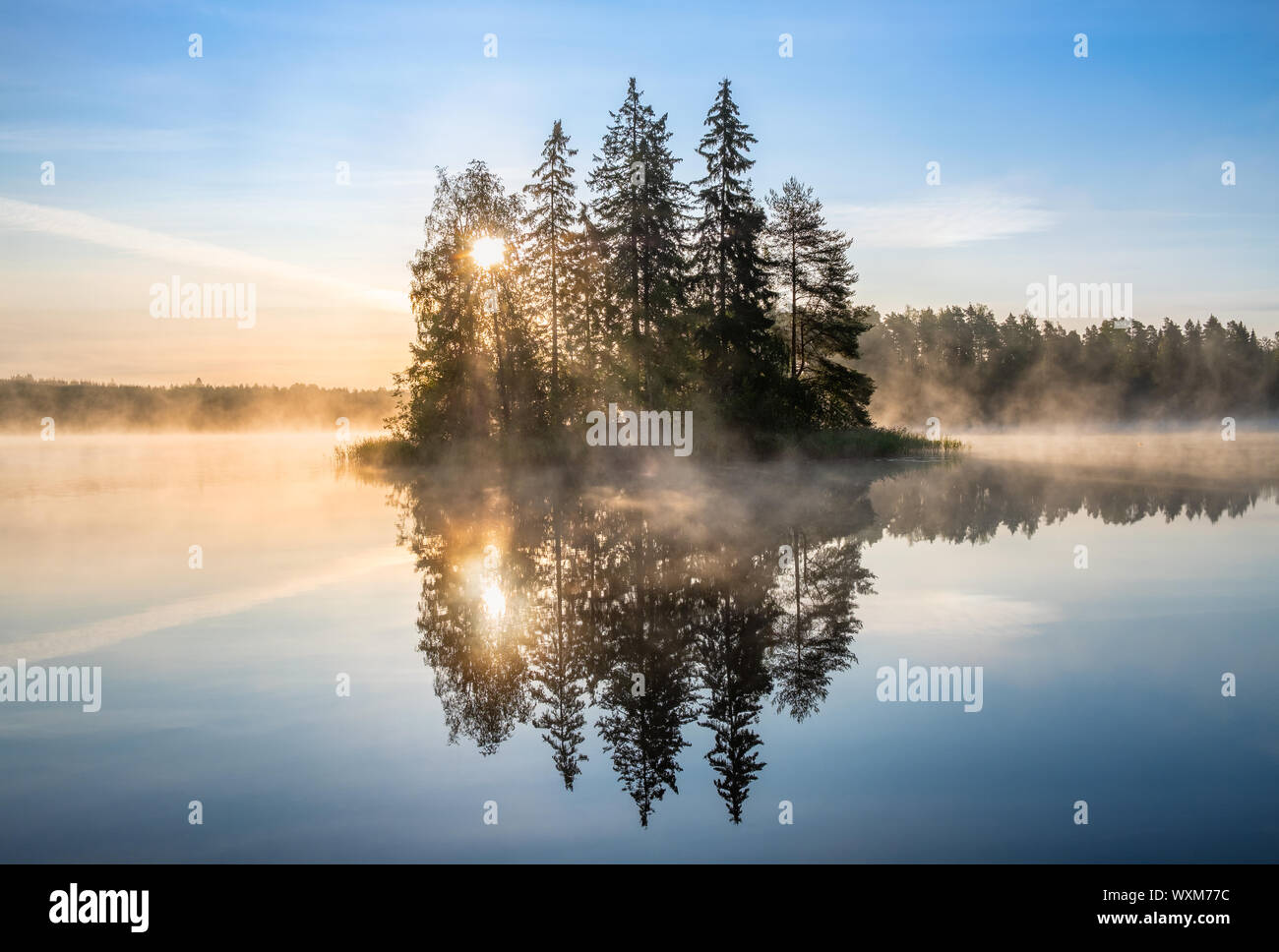 Beautiful morning glow with calm landscape with mood sunrise and sunlight at summer morning in Finland Stock Photo