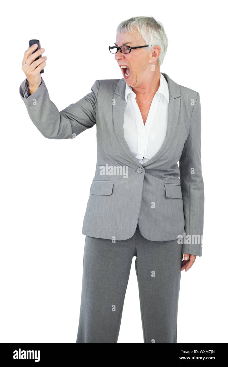 Screaming Call Furious businesswoman screaming during a call on white background Stock ...