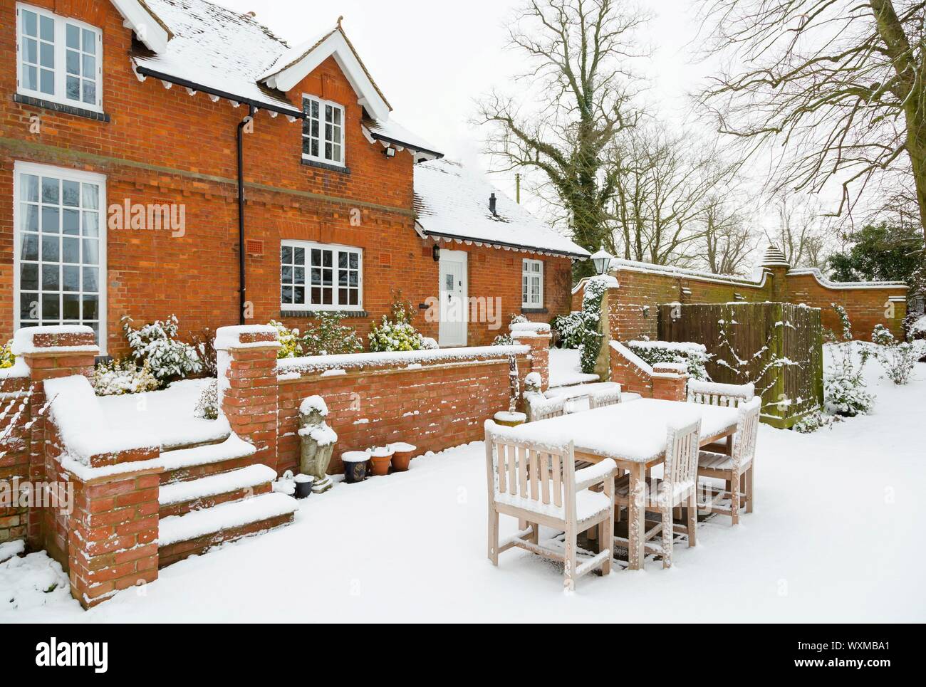 English mansion, luxury family house covered in snow in winter, UK Stock Photo