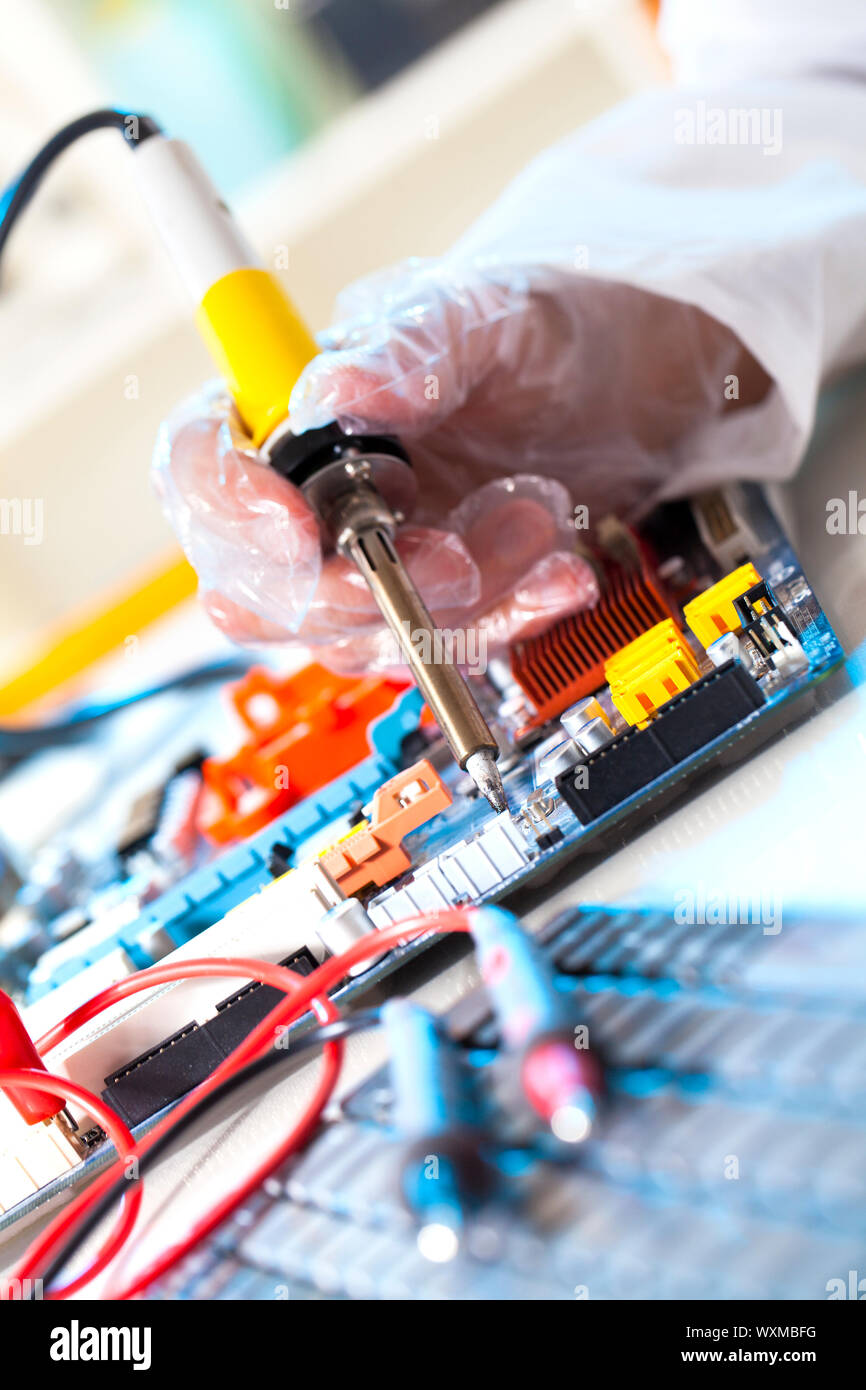 soldering electronic parts on a printed circuit board Stock Photo Alamy