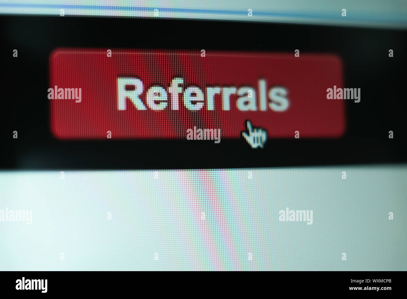 Close up Red button referals on a  white background. Stock Photo