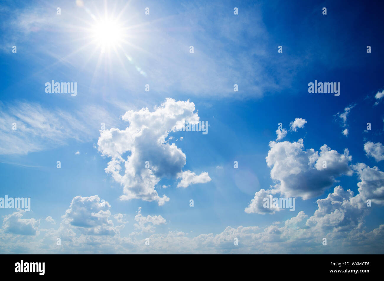 white fluffy clouds in the blue sky Stock Photo - Alamy