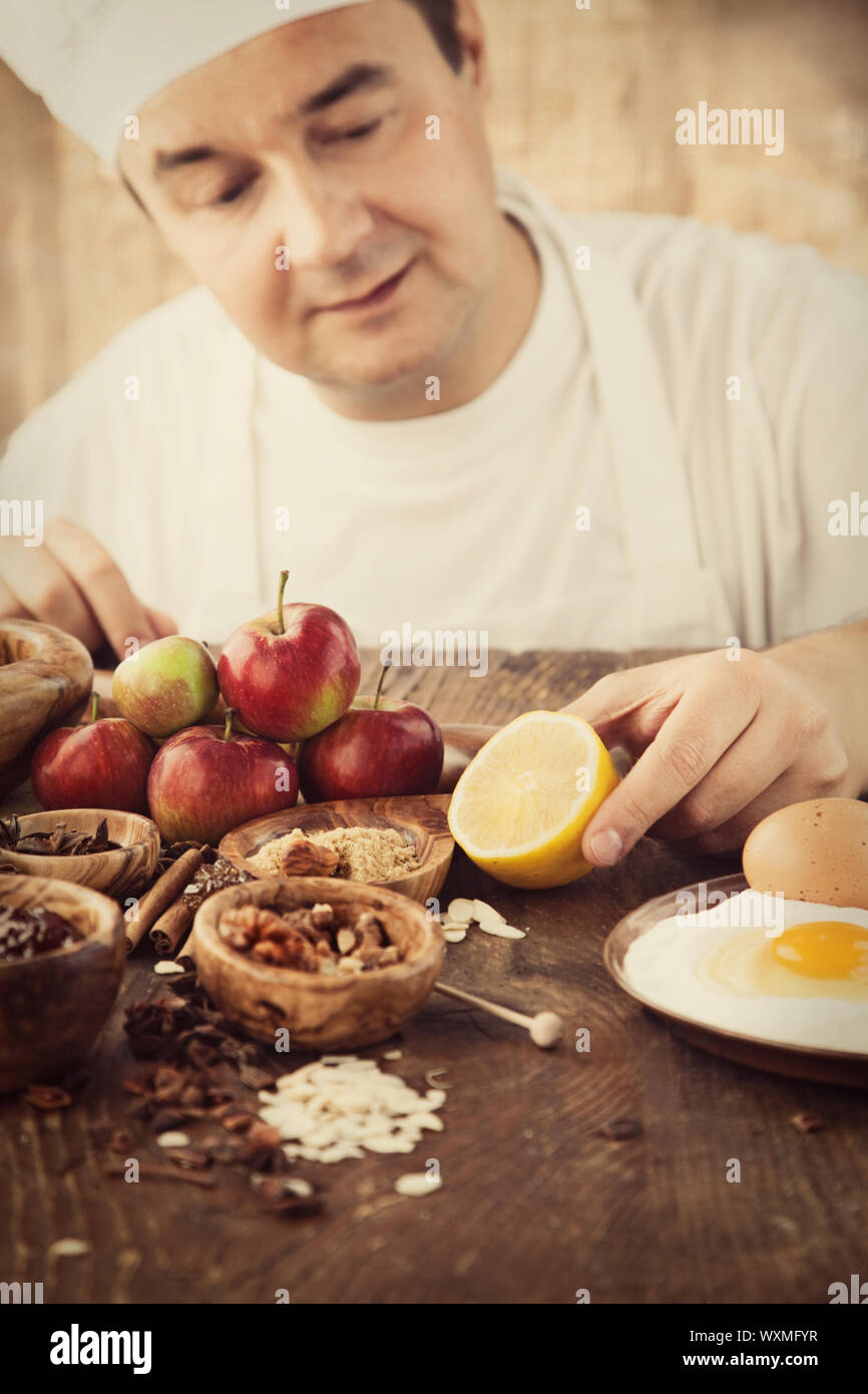 Baking concept background. Baker with ingredients for pastry desserts ...