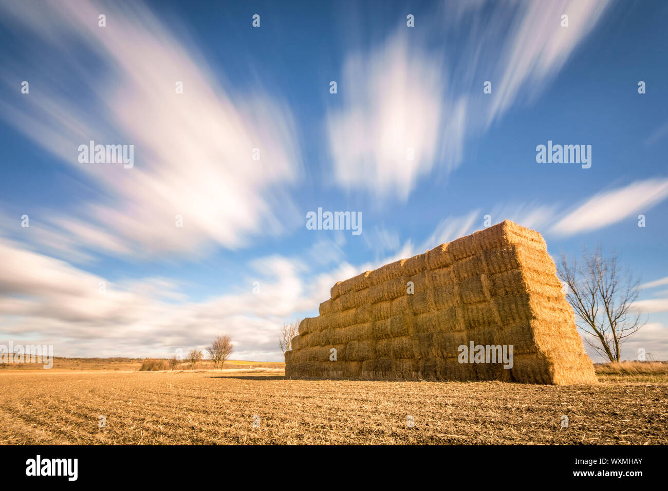 Fast moving clouds over rural region Stock Photo