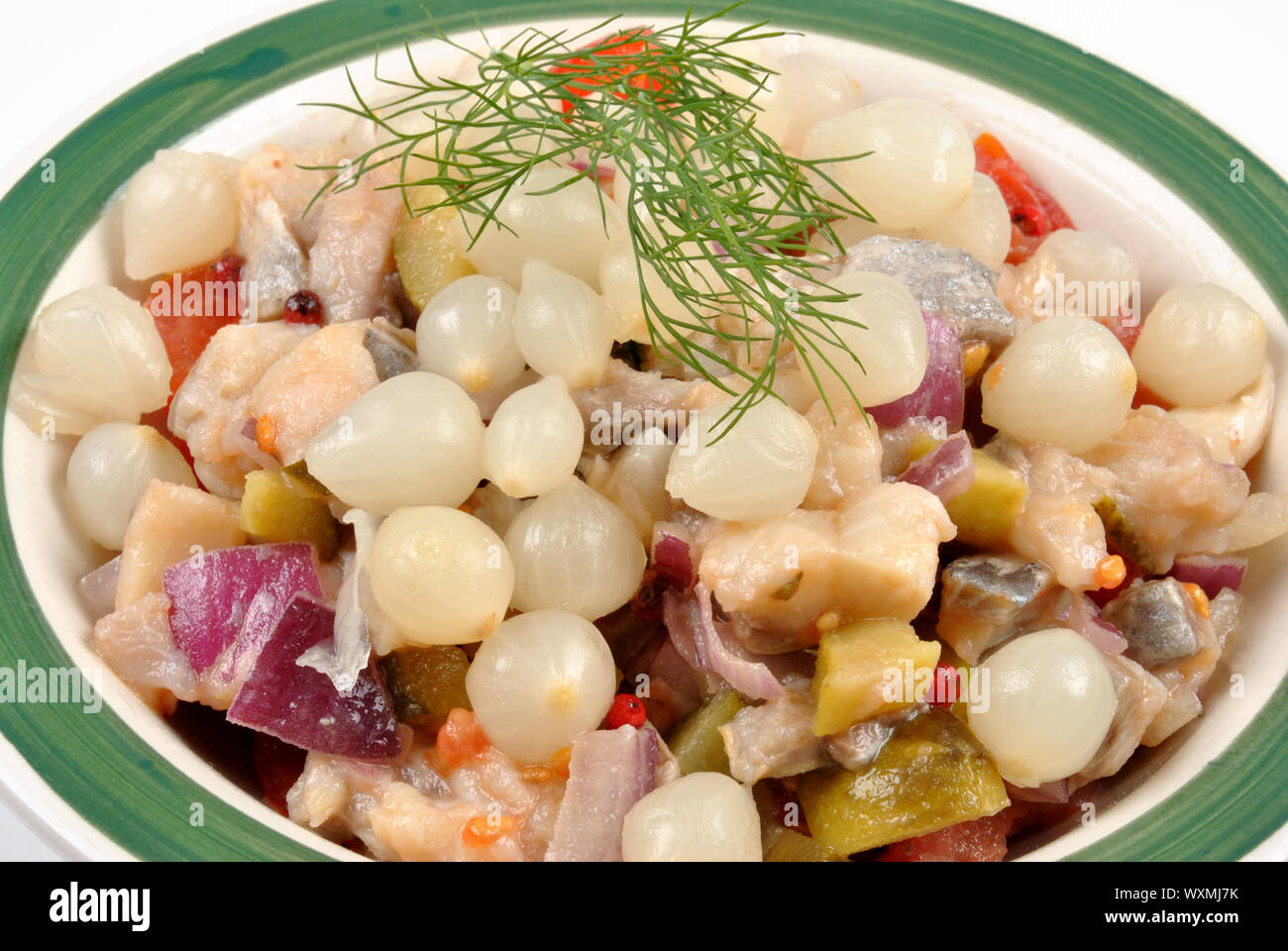 some fresh organic herring salad in a bowl Stock Photo - Alamy