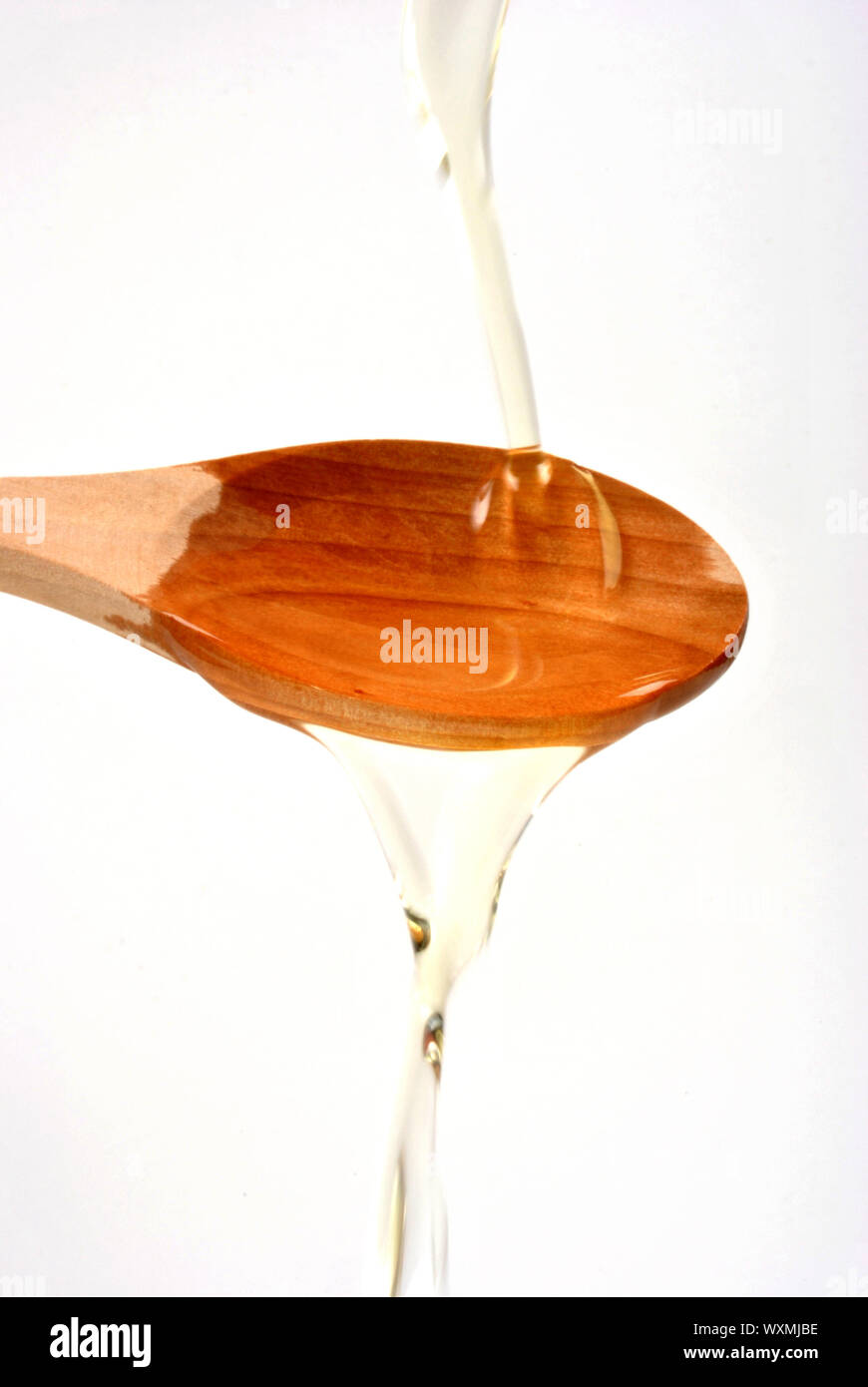 organic olive oil and a timber spoon Stock Photo - Alamy