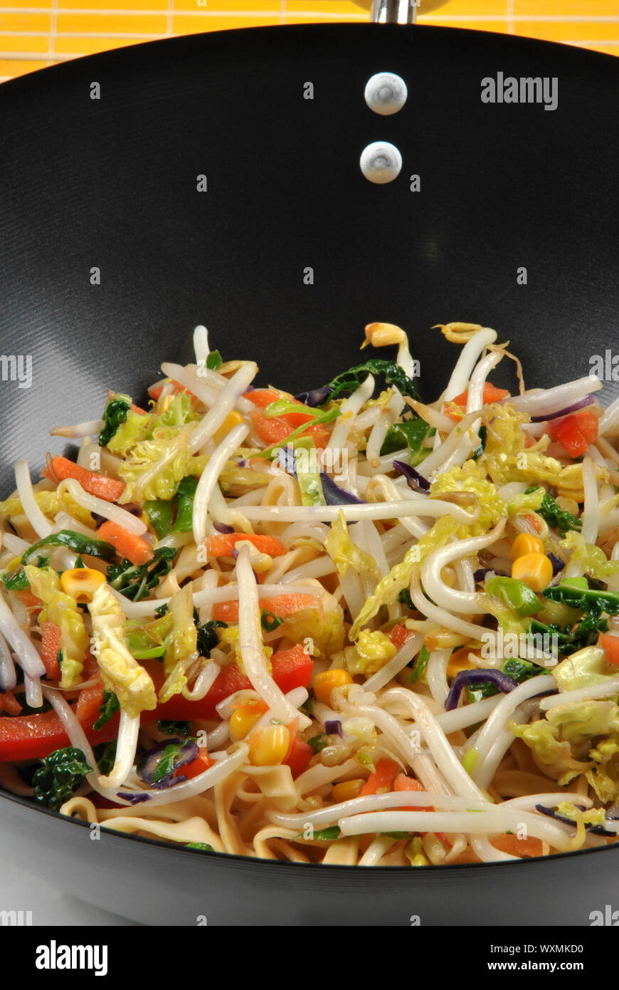 organic stir fry with oil in a wok Stock Photo Alamy
