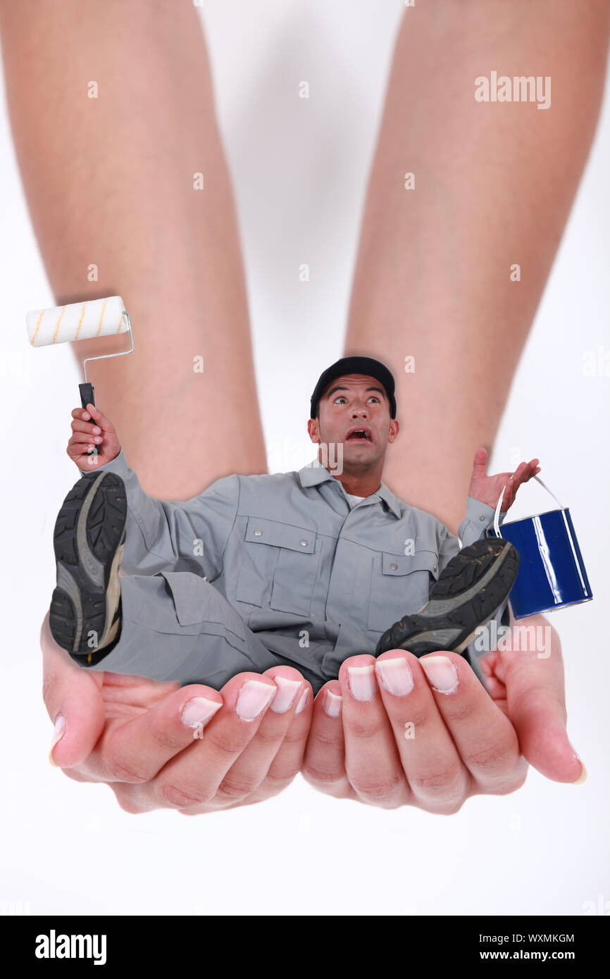 Photomontage of a man falling in hands of a woman Stock Photo