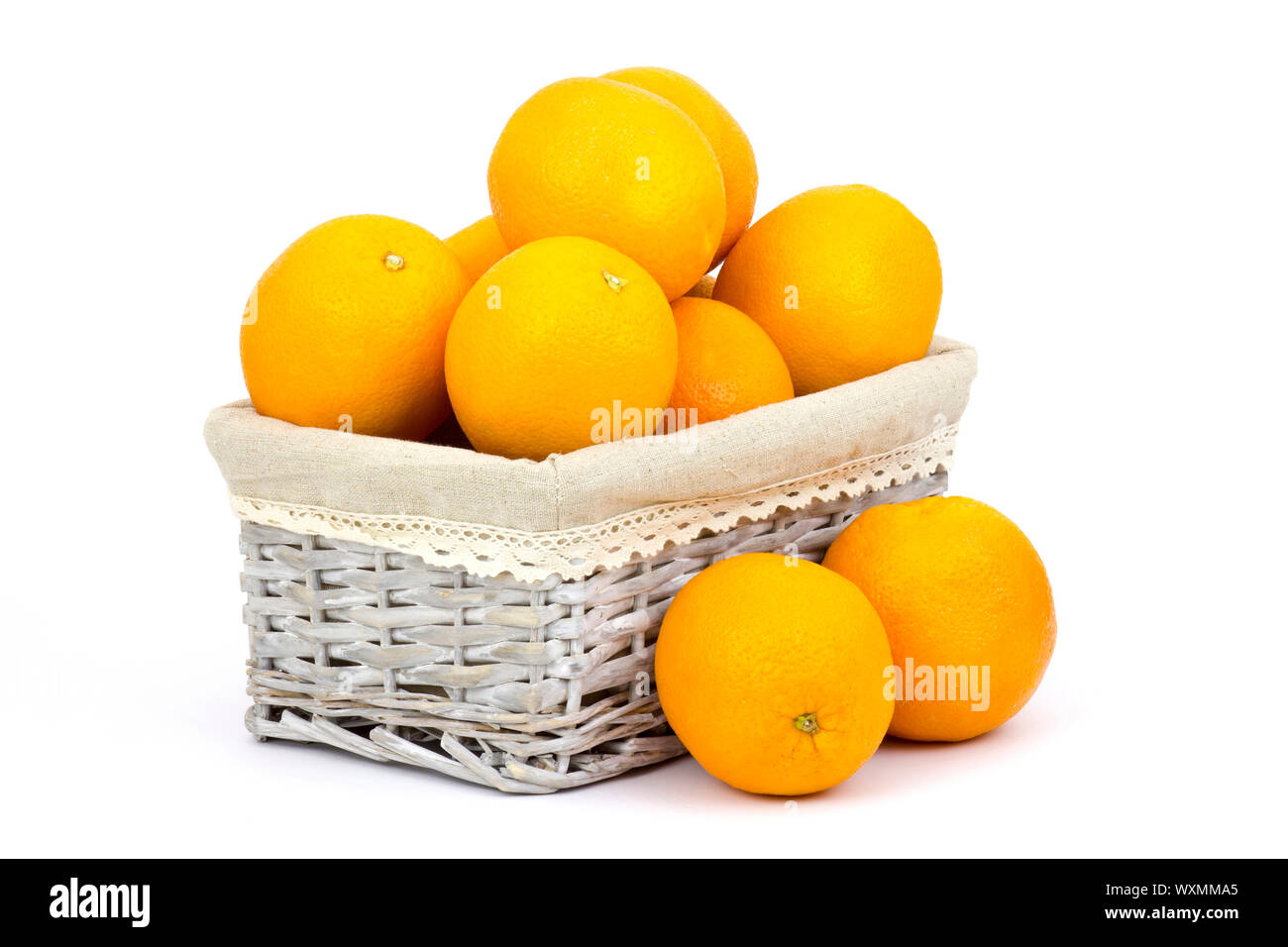 fresh oranges in a basket on white background Stock Photo Alamy