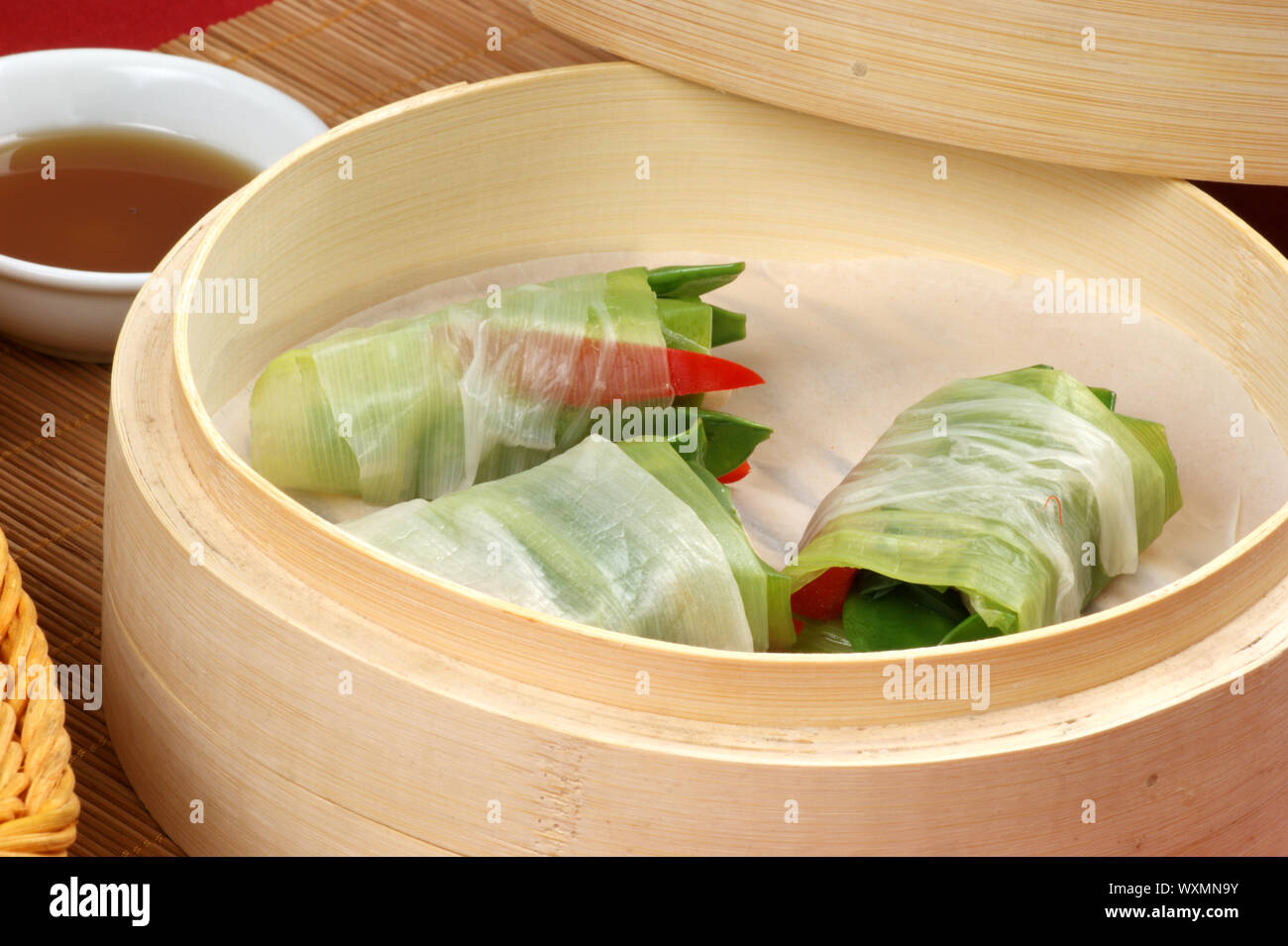 asian style chicken and vegetable bundles Stock Photo Alamy