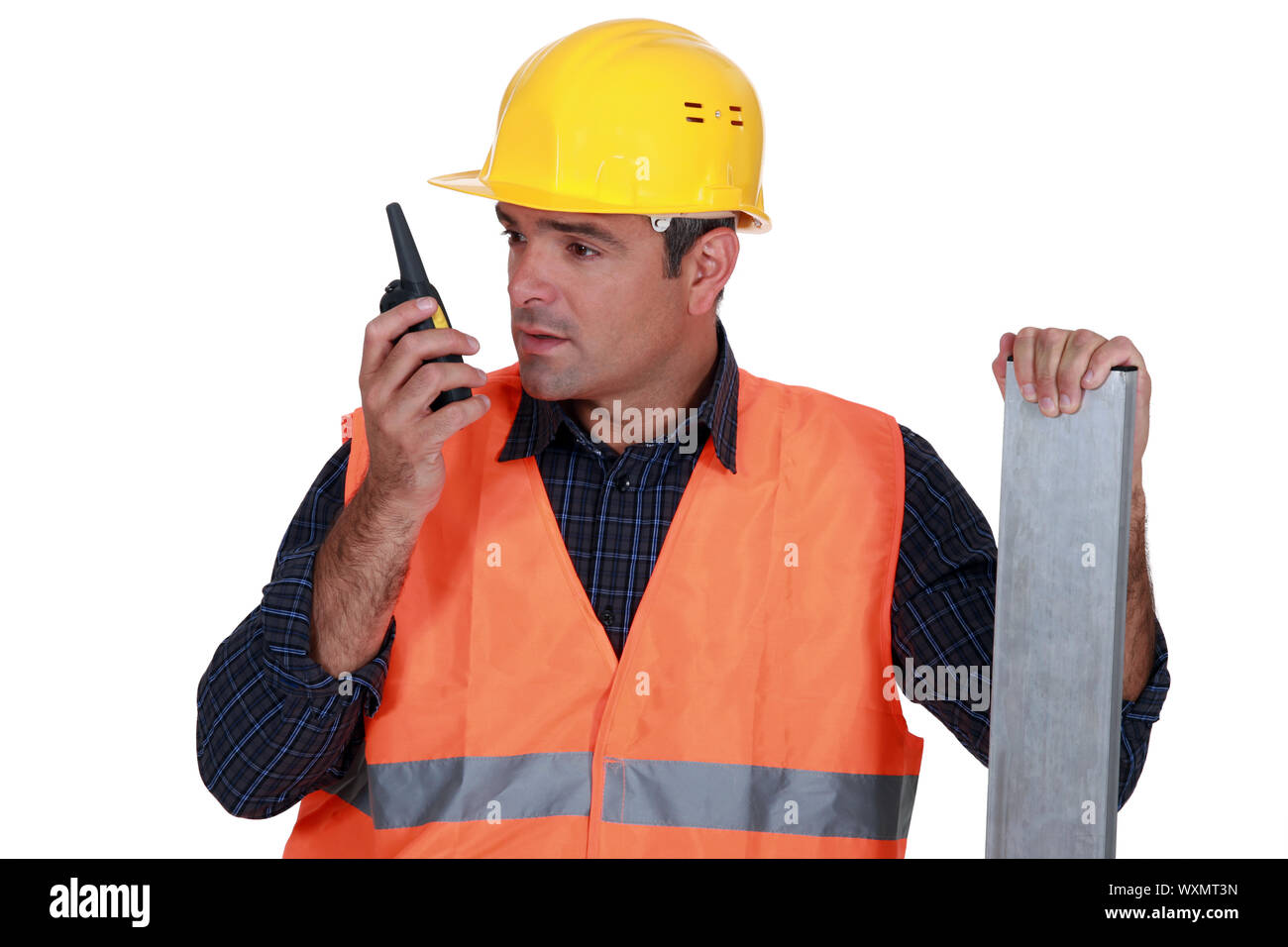 Craftsman using a walkie-talkie Stock Photo
