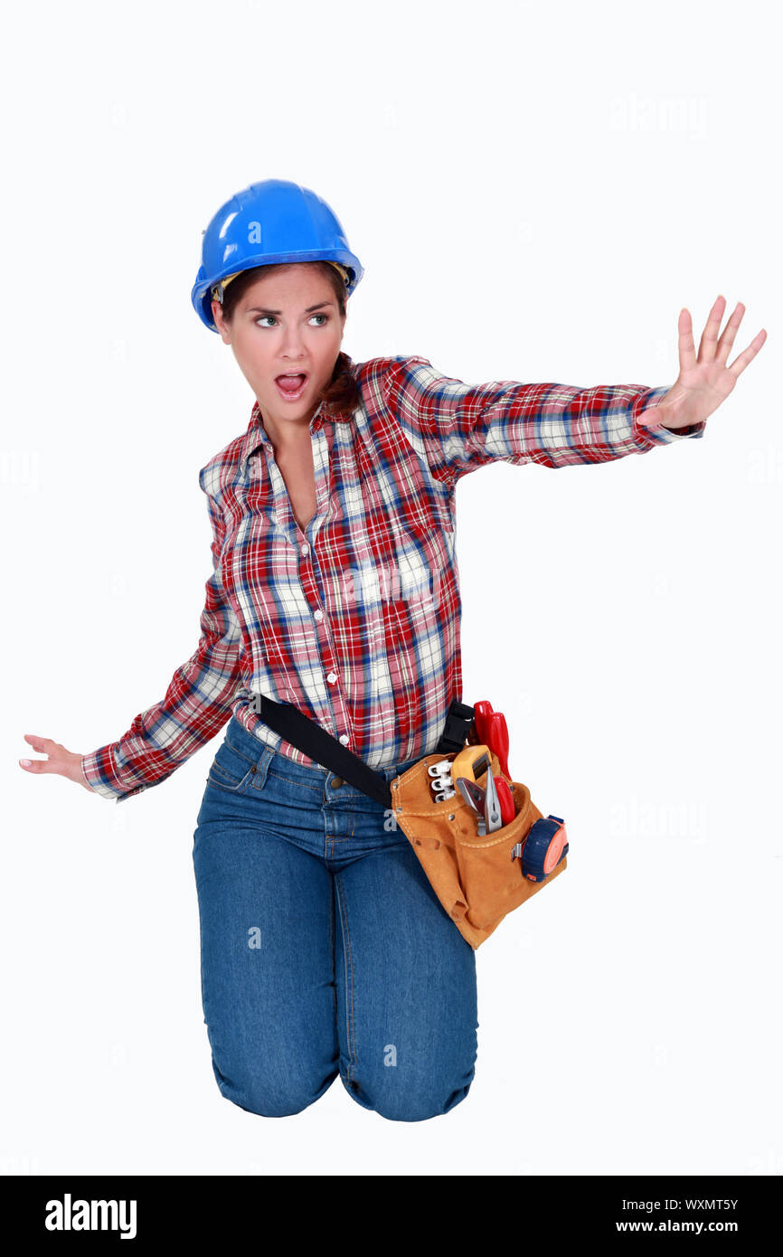 Female laborer doing sign with her hand Stock Photo - Alamy