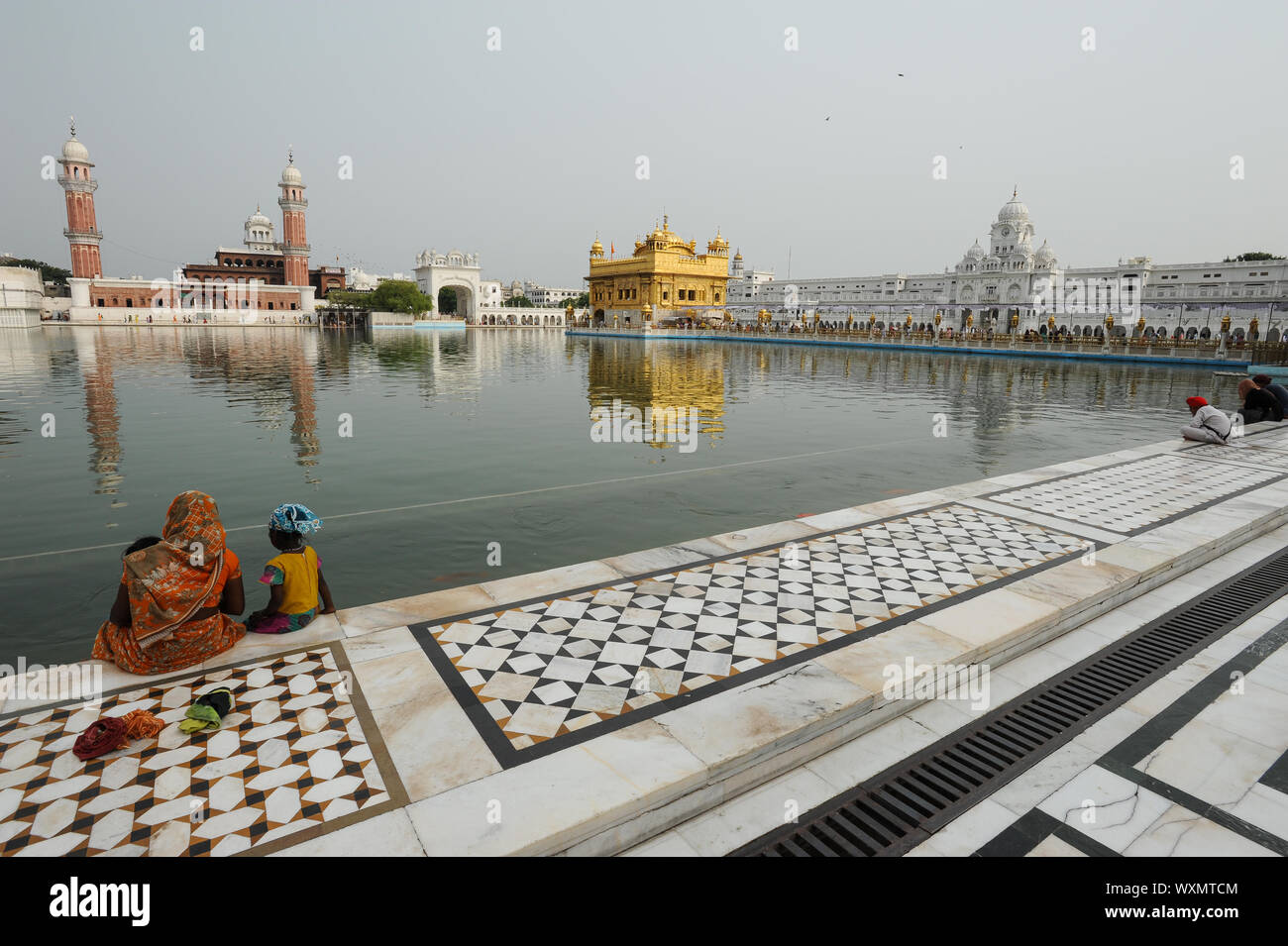 22-07-2011-amritsar-punjab-india-sikh-devotees-at-the-amrit