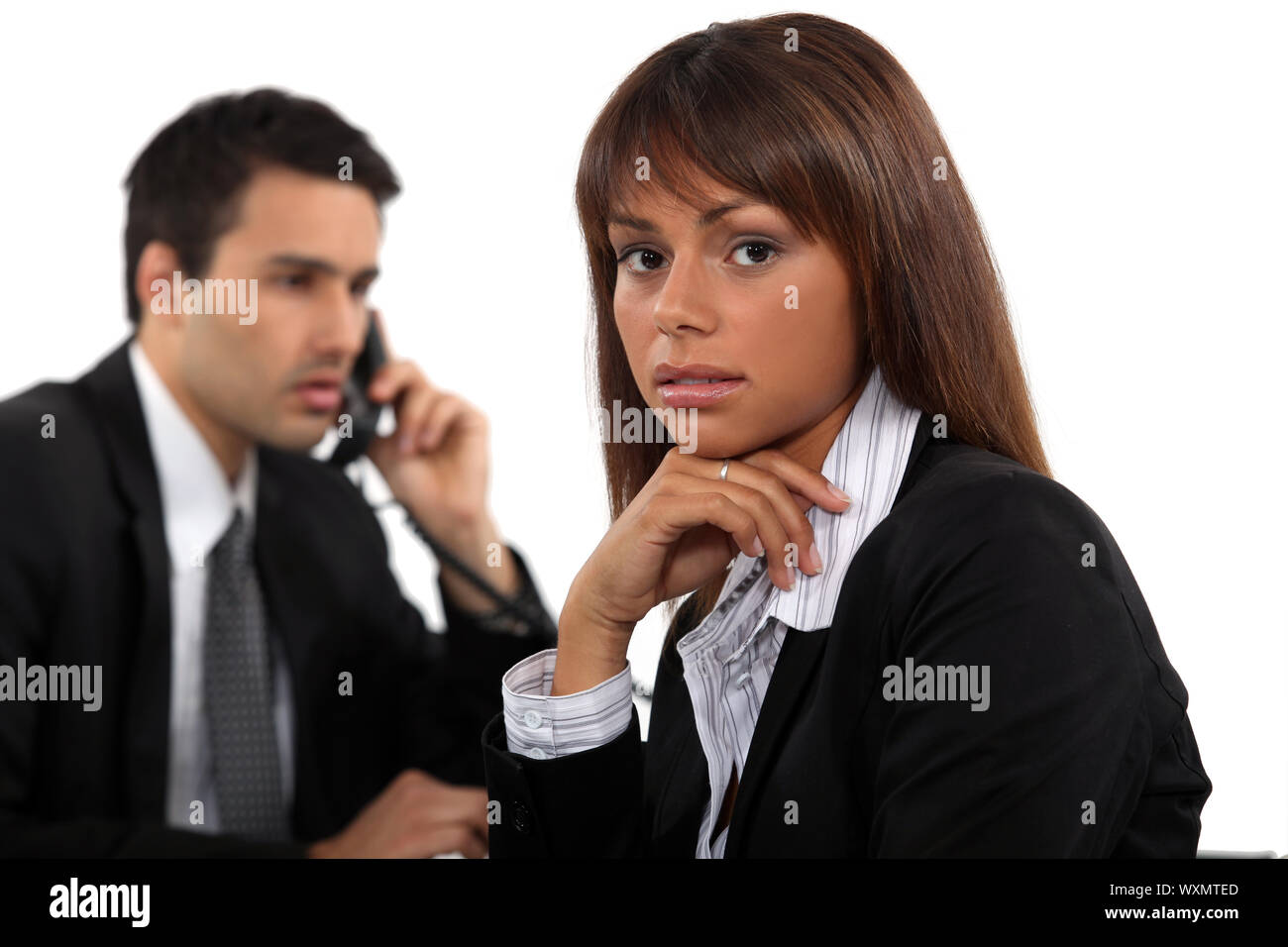 Two young businesspeople working together Stock Photo