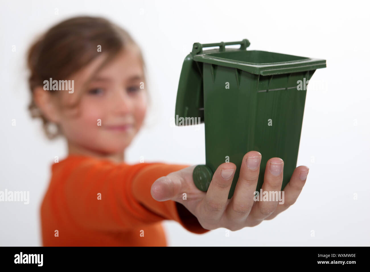 Girl holding recycling bin Stock Photo Alamy