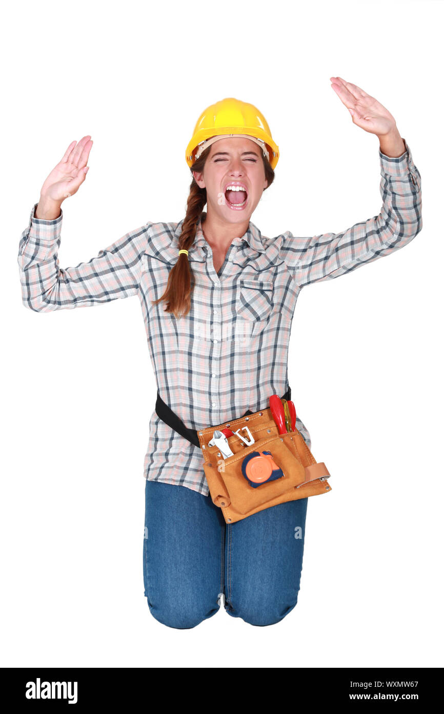 A female manual worker trapped in a box. Stock Photo