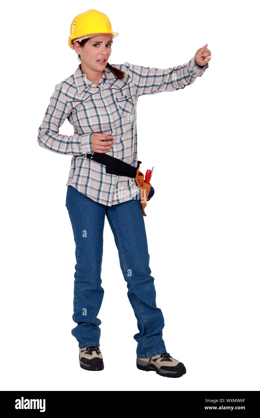 Worried construction worker pointing Stock Photo - Alamy