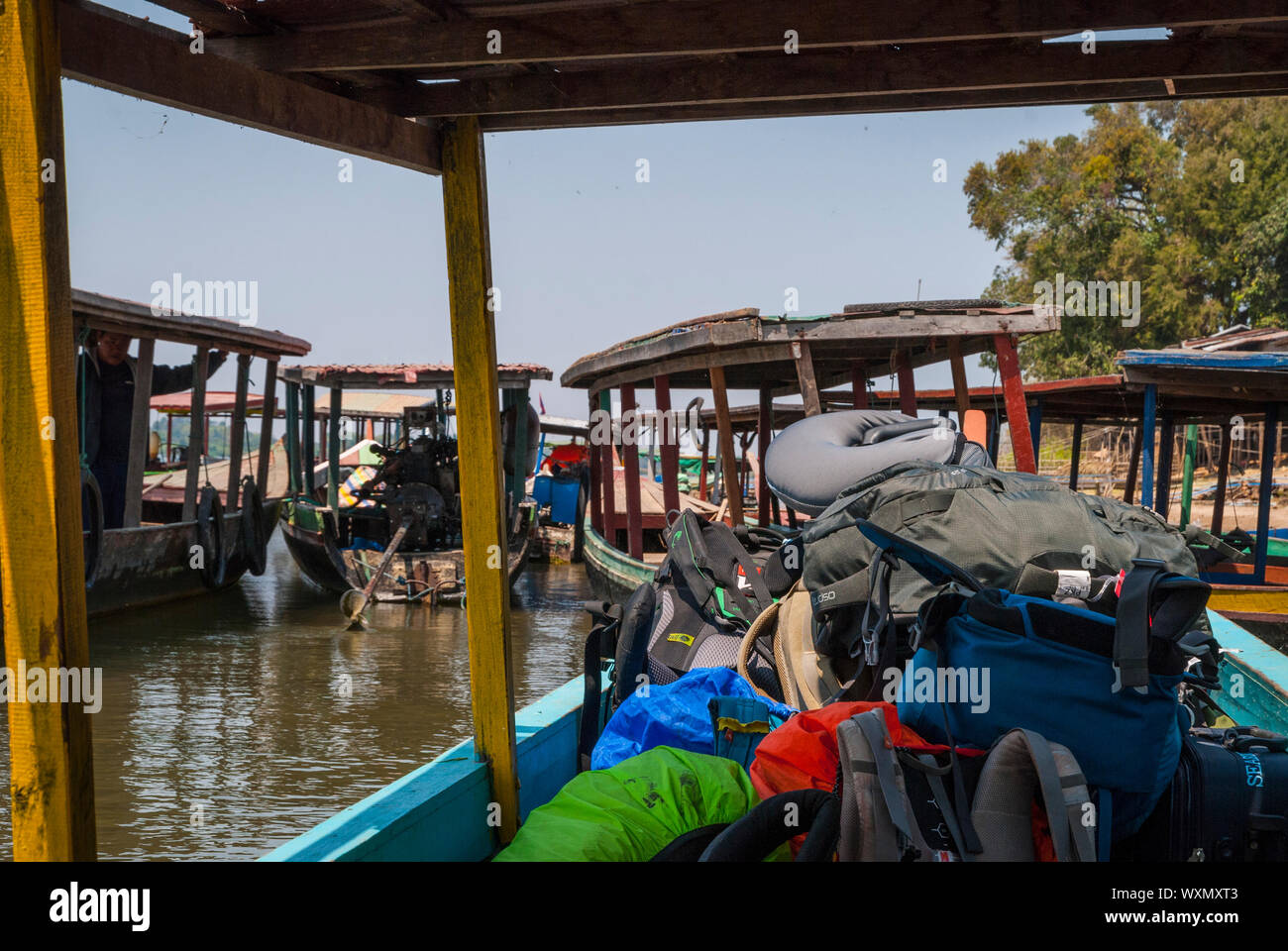 Transporting backpacks by boats, Laos Stock Photo - Alamy