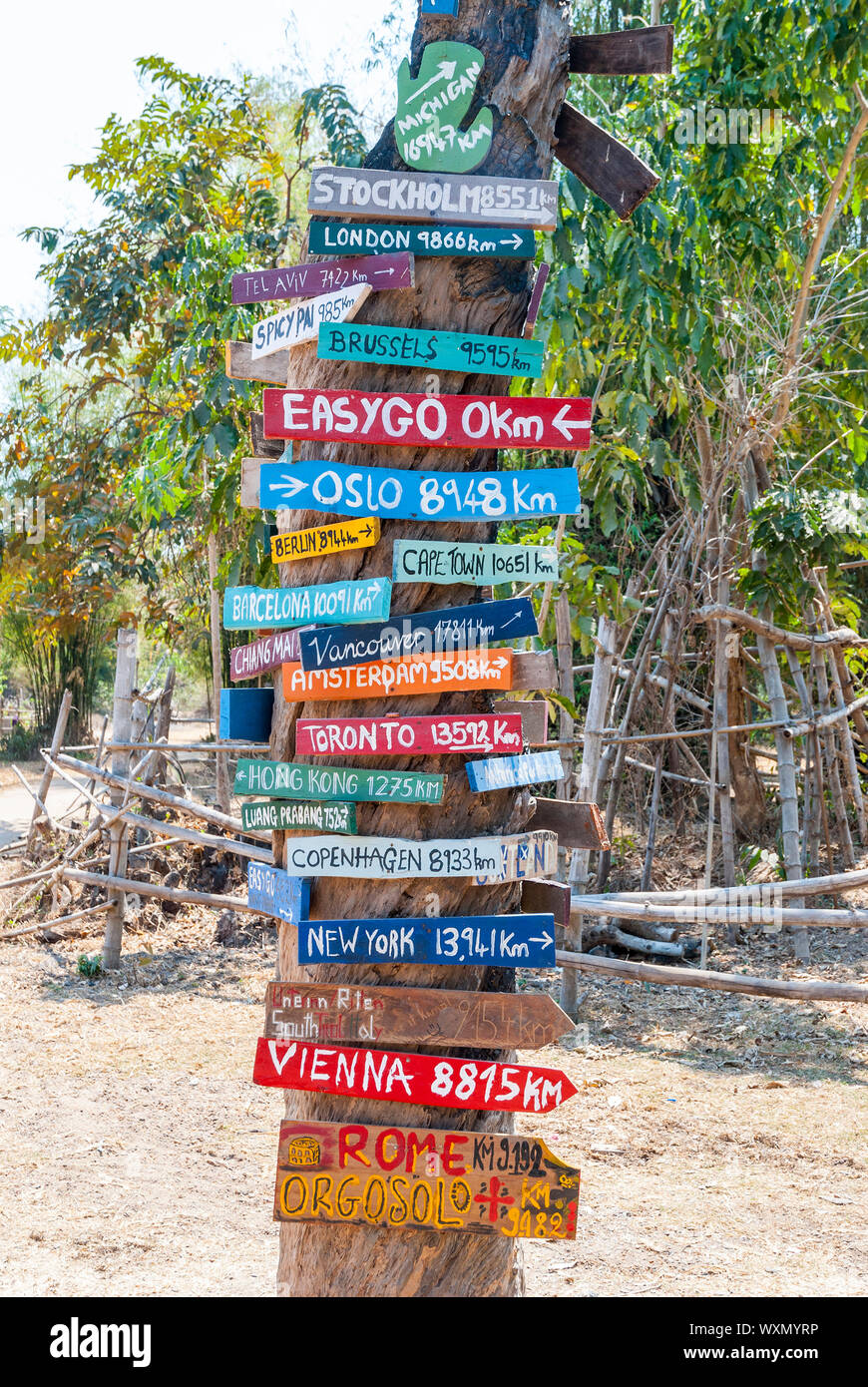 Sign with cities and distances from Laos Stock Photo