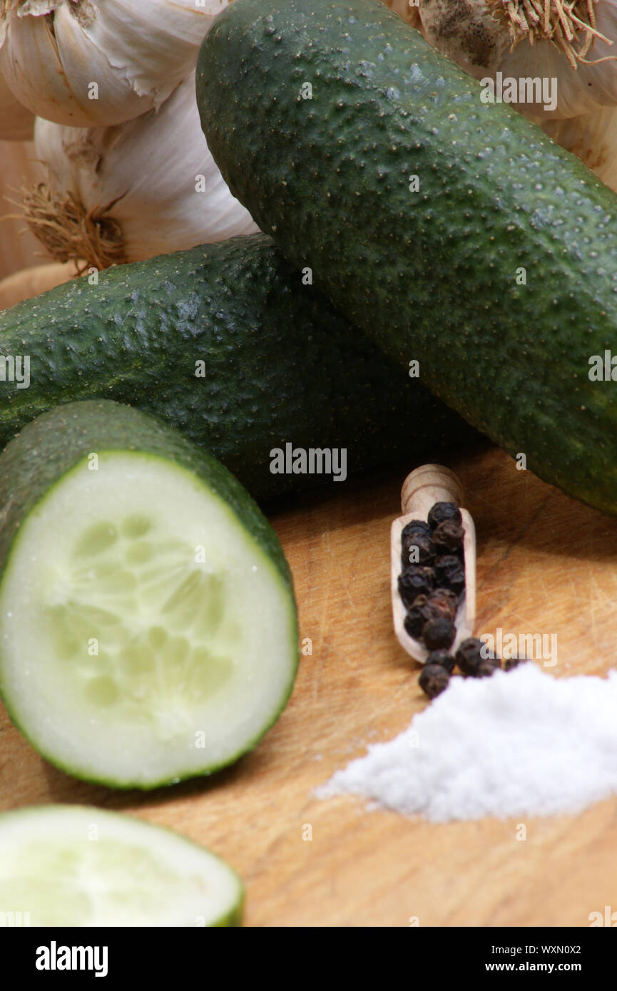 organic gherkin with salt on a timber board Stock Photo - Alamy