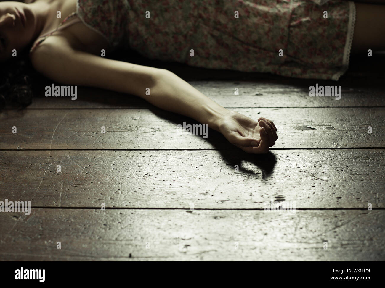 Cropped image of a woman lying on the floor Stock Photo