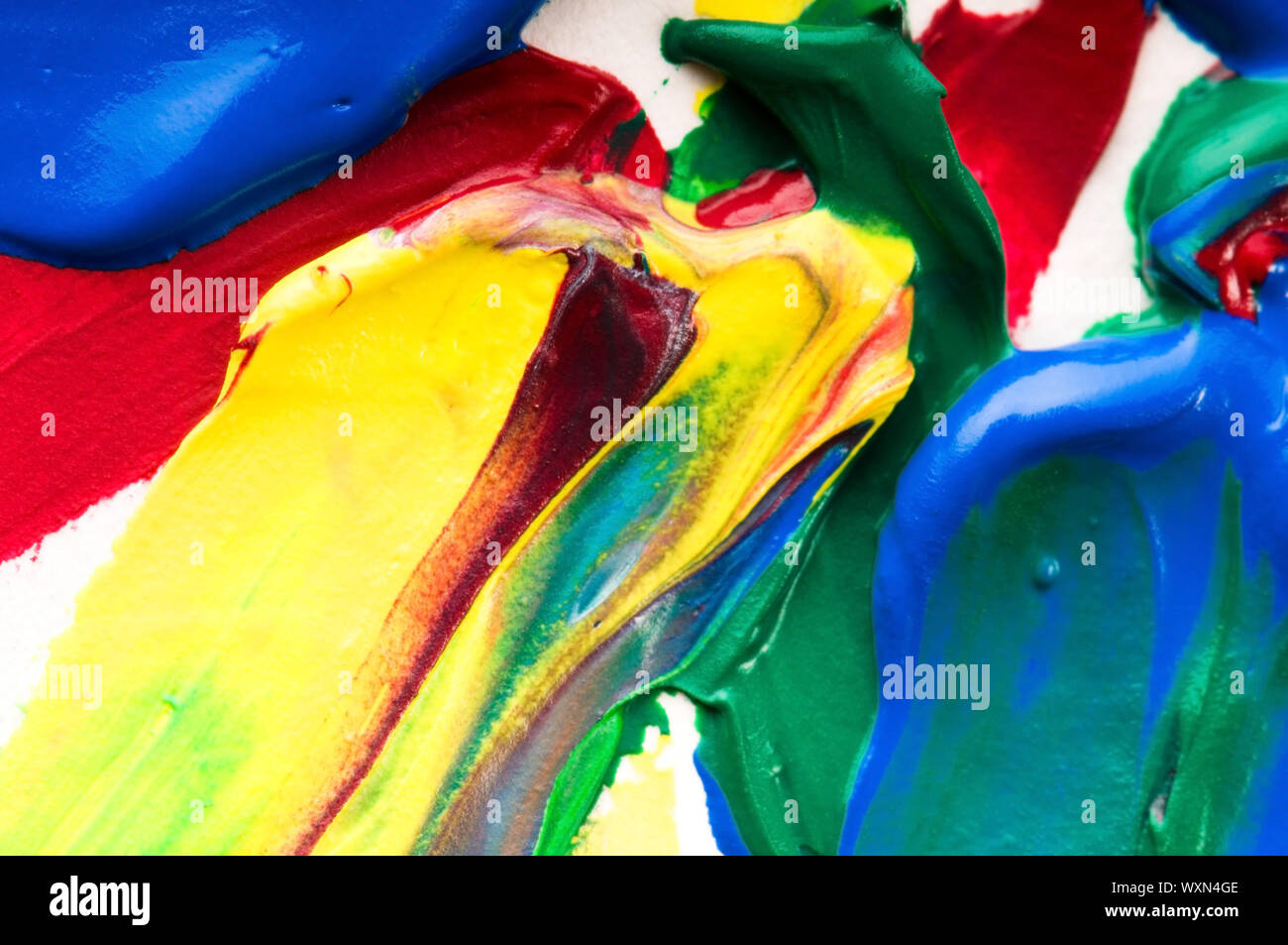 Mixing red and blue paints purple hi-res stock photography and images