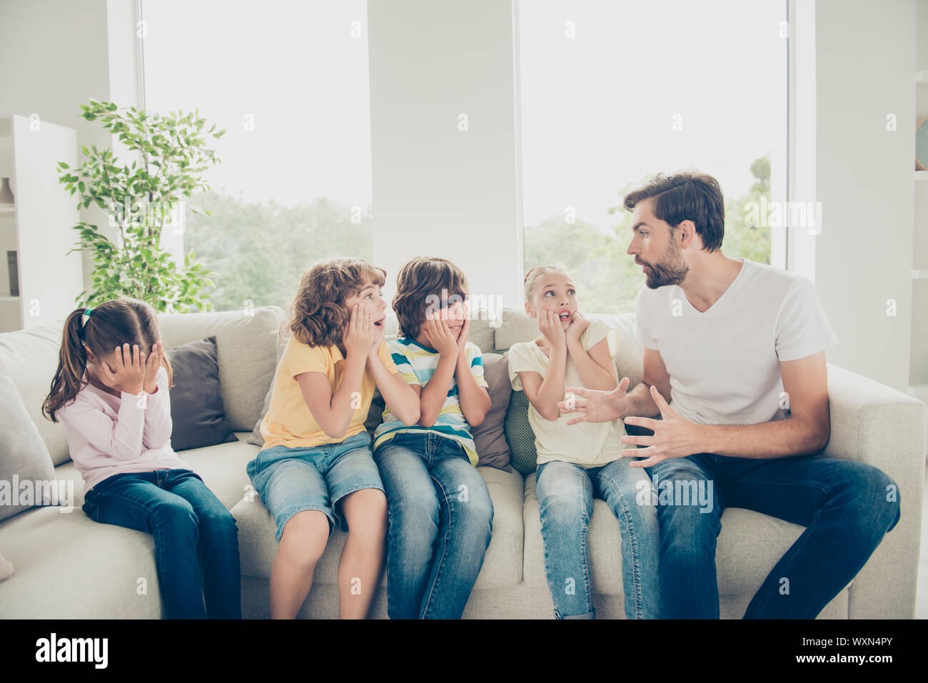 Free time preteen pre-teen concept. Babysitter tell scare story Stock Photo