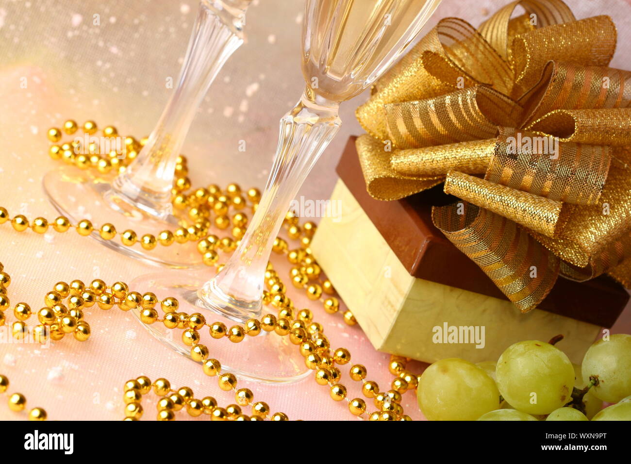 holiday card golden champagne and gift Stock Photo