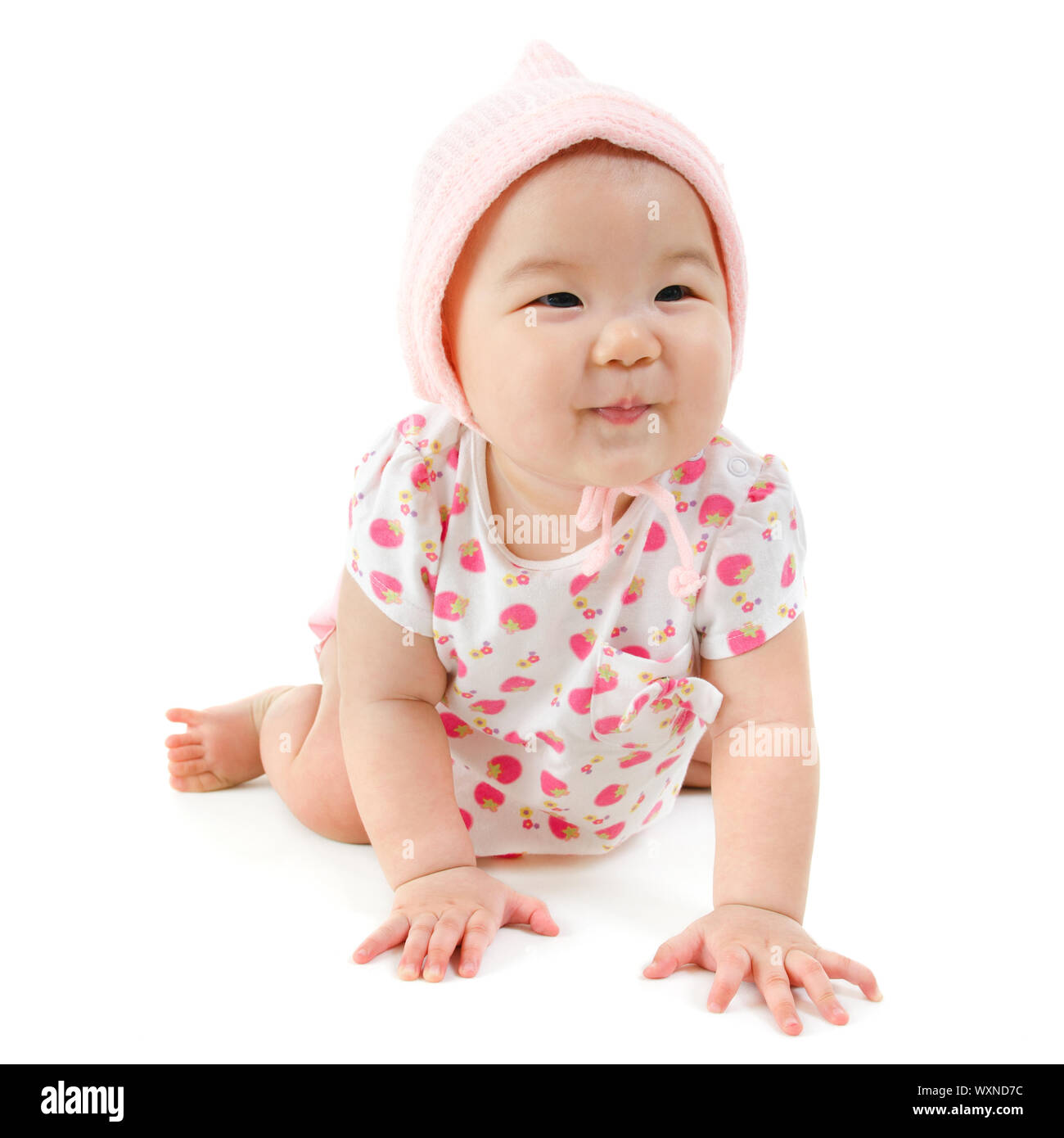 Six months old Asian mixed race baby girl crawling over white ...