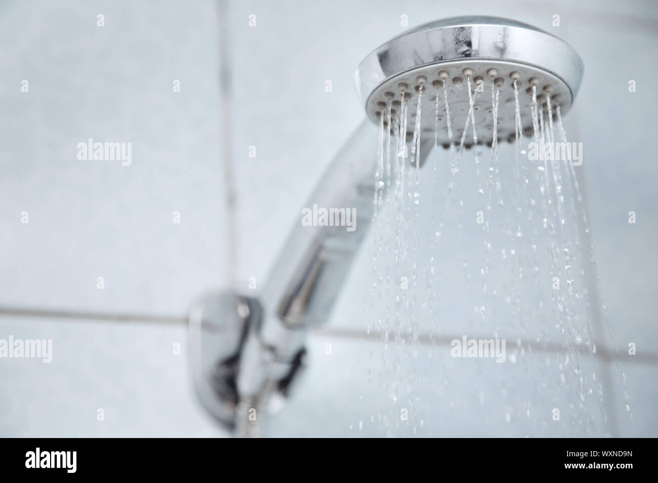 Shower in bathroom with water flowing Stock Photo - Alamy