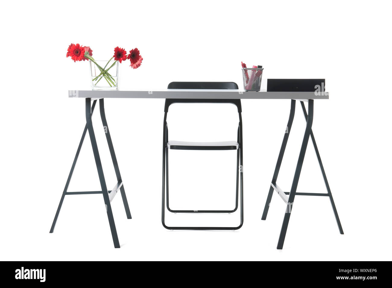 Empty desk with flowers and chair Stock Photo Alamy