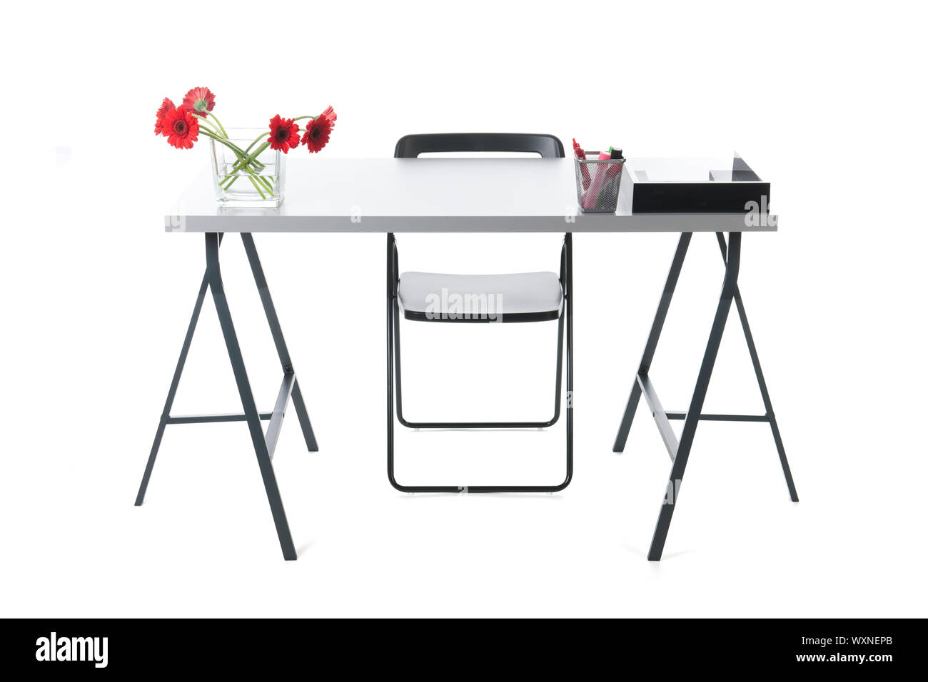 Empty desk with flowers and chair Stock Photo Alamy