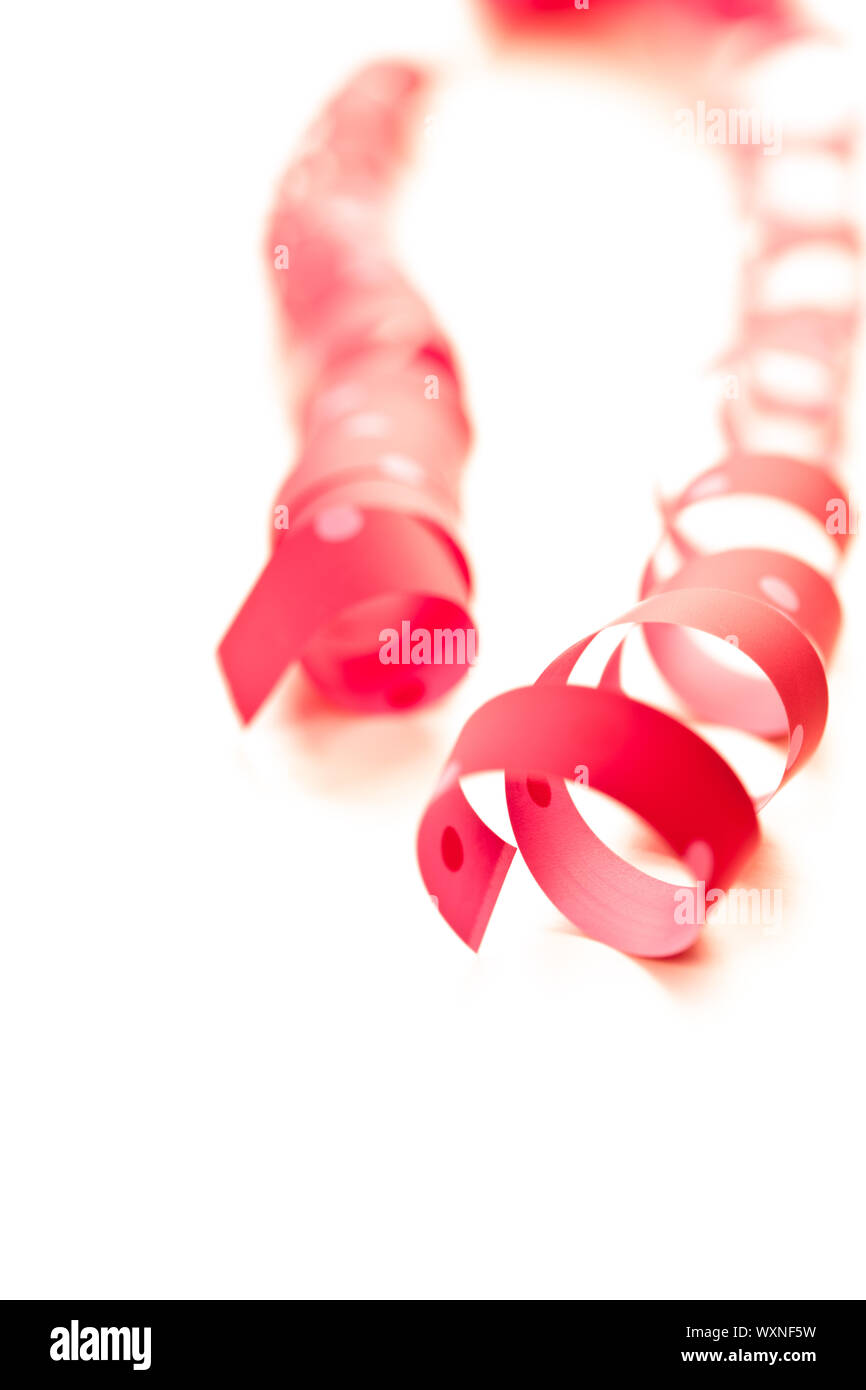 red ribbon serpentine isolated on white background Stock Photo - Alamy