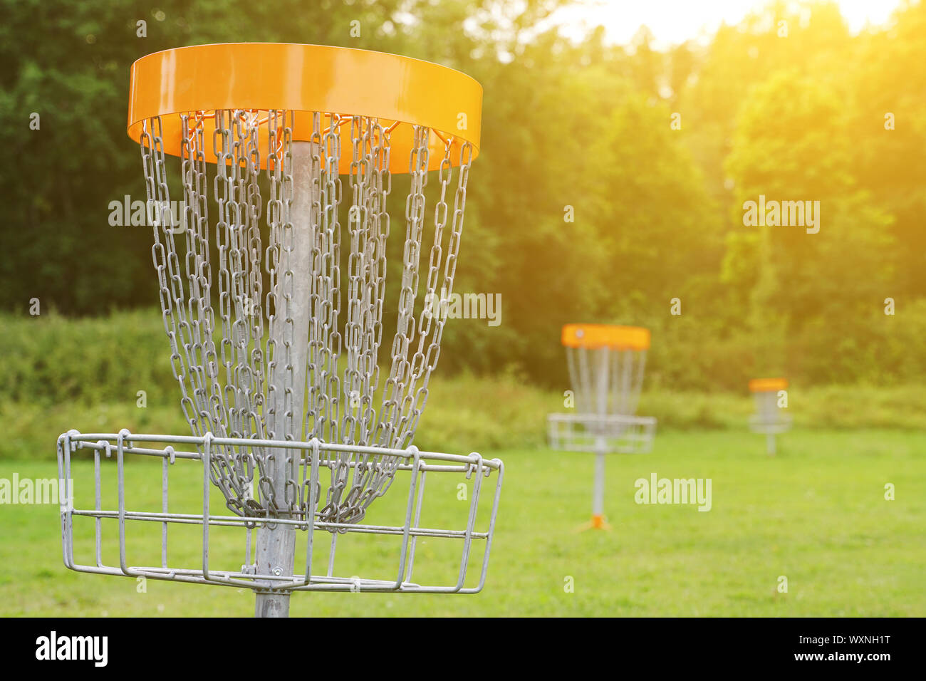 Disc golf basket in the park Stock Photo Alamy