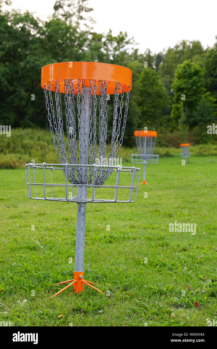 Disc golf basket in the park Stock Photo Alamy