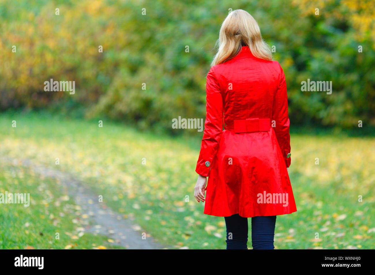 Woman coat walking rear view blond hi-res stock photography and images ...
